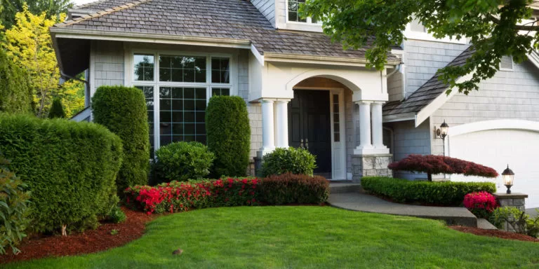 Aerial view of a residential home with a healthy lawn maintained by Lawn Ace, providing local lawn care services in North Augusta and the CSRA.