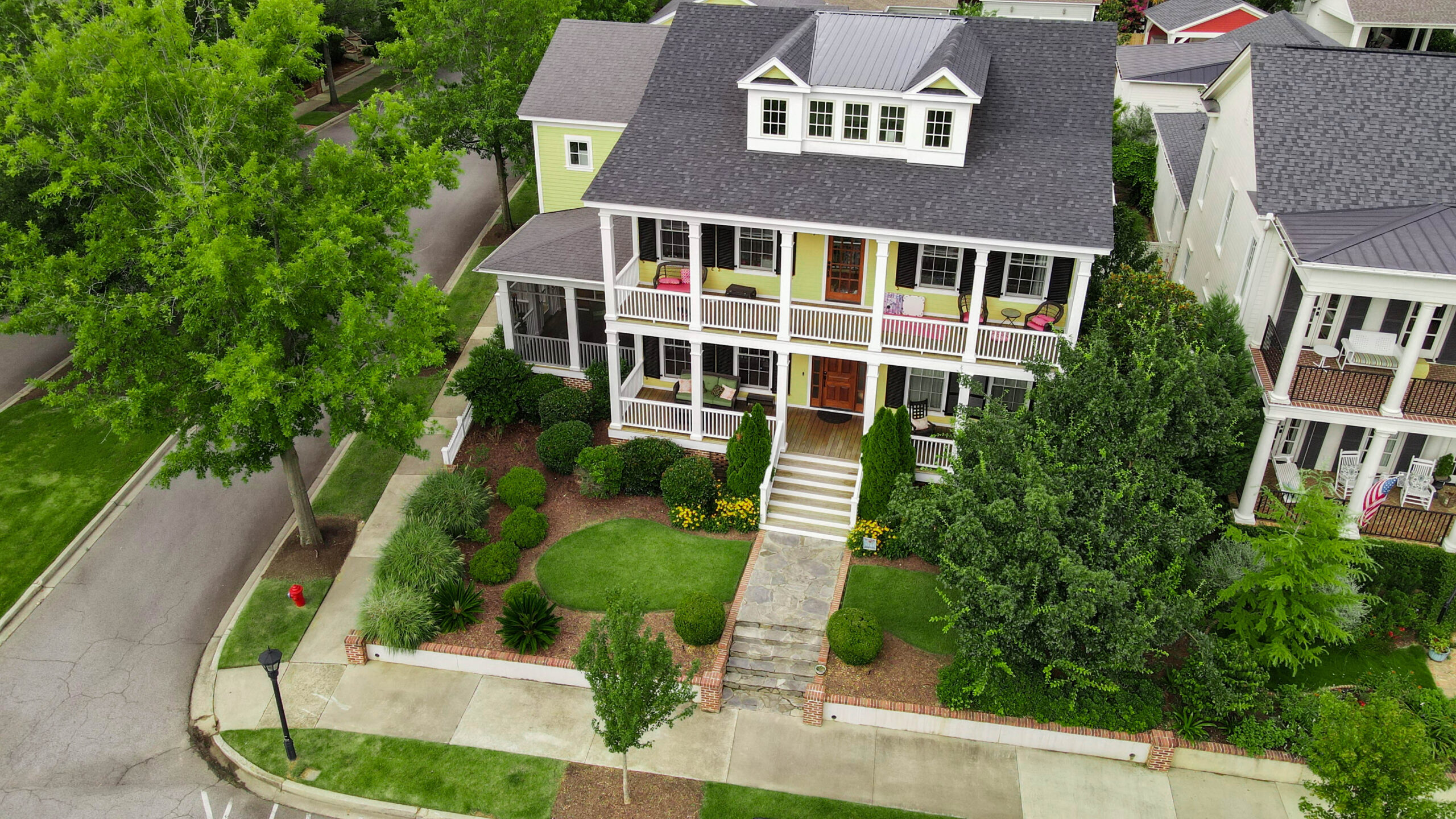 Aerial view of a residential home with a healthy lawn maintained by Lawn Ace, providing local lawn care services in North Augusta and the CSRA.